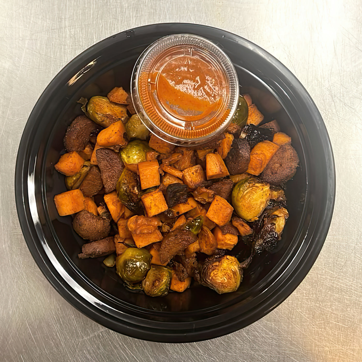 Smokey Sausage & Brussels Sprouts Hash with Sweet Potatoes & Maple Chipotle Crema